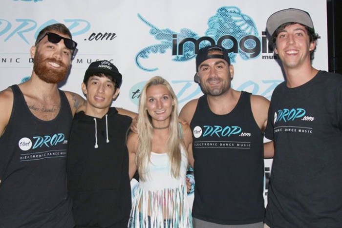 Team members pose with Crizzly during the artist meet and greet at Imagine Music Festival in Atlanta, Georgia.