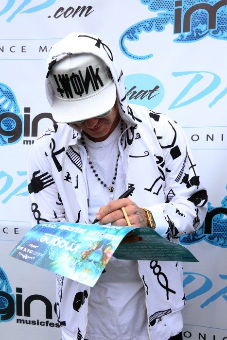 Brillz signs an autograph during our artist meet and greet at Imagine Music Festival