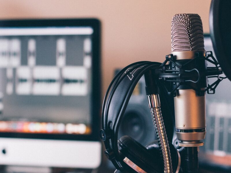 black and silver headphones on black and silver microphone