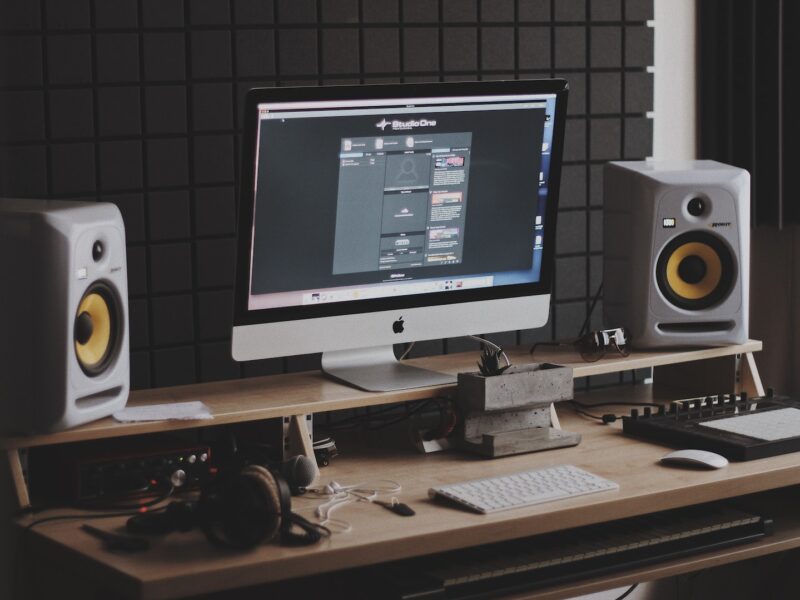 silver iMac turned on at the table