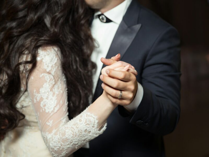 man and woman dancing wearing casual dresses