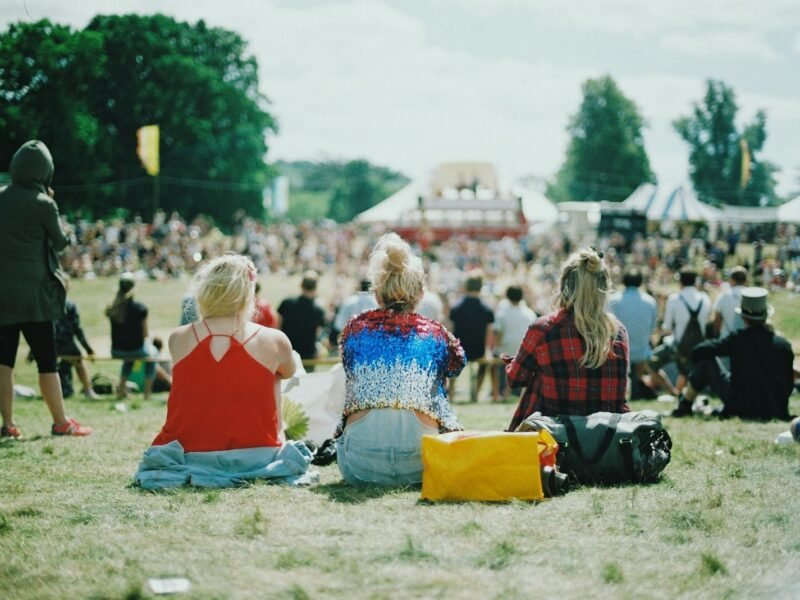 group of people on grass field under sunny day