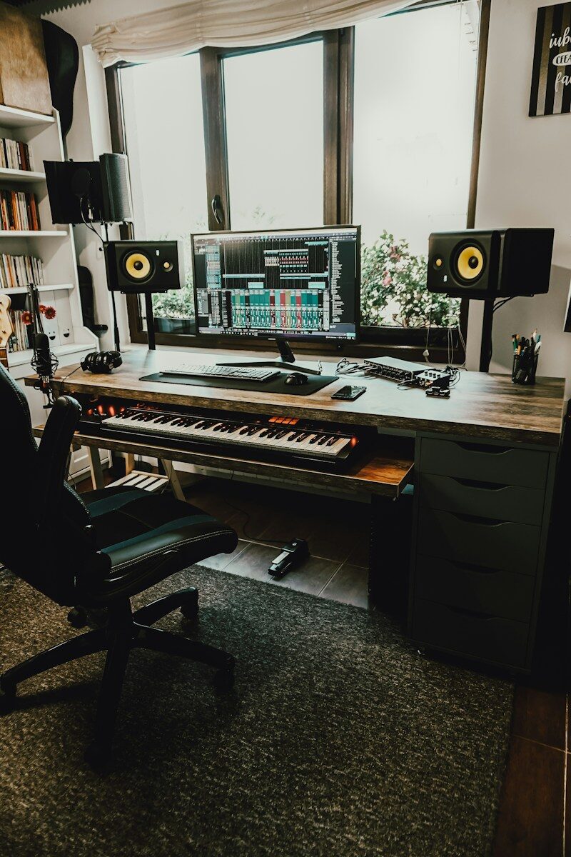 black flat screen computer monitor on brown wooden desk